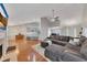 Open-concept living room showcasing hardwood floors, modern furnishings, and plenty of natural light at 964 Natural Brook Trl, Lawrenceville, GA 30045