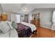 Main bedroom offering hardwood floors, a vaulted ceiling, and large furniture at 964 Natural Brook Trl, Lawrenceville, GA 30045