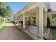 Covered patio area provides an outdoor seating area surrounded by a lush backyard at 964 Natural Brook Trl, Lawrenceville, GA 30045