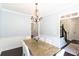 Dining room featuring chandelier and hardwood floors, adjacent to staircase at 20 Scarlett Oak Ne Dr, Cartersville, GA 30121