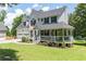 Attractive two-story home featuring a covered porch, two-car garage, and lush green lawn at 20 Scarlett Oak Ne Dr, Cartersville, GA 30121