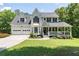 Charming two-story home with a well-manicured lawn, covered porch, and a two-car garage at 20 Scarlett Oak Ne Dr, Cartersville, GA 30121