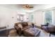 Spacious living room with comfortable leather seating, wood floors, and large windows for natural light at 20 Scarlett Oak Ne Dr, Cartersville, GA 30121