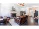 Cozy living room showcasing a stone fireplace, wood floors, and comfortable leather furniture at 20 Scarlett Oak Ne Dr, Cartersville, GA 30121