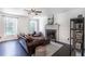 Bright living room featuring wood floors, a stone fireplace, and plenty of natural light at 20 Scarlett Oak Ne Dr, Cartersville, GA 30121