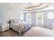 Spacious main bedroom with tray ceiling, carpet, and windows at 20 Scarlett Oak Ne Dr, Cartersville, GA 30121