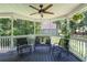Relaxing outdoor space on the covered porch with comfortable seating and views of the surrounding trees at 20 Scarlett Oak Ne Dr, Cartersville, GA 30121