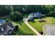 Expansive property featuring a blue-sided home, a long driveway, and a beautiful manicured lawn and garden at 200 Chaparral Trce, Tyrone, GA 30290