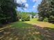 Large backyard with lawn and landscaping and a view of the house at 200 Chaparral Trce, Tyrone, GA 30290