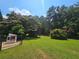Large, grassy backyard perfect for outdoor activities and enjoying nature's beauty at 200 Chaparral Trce, Tyrone, GA 30290