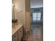 Spacious bathroom with double sinks, a framed mirror with vanity, and a walk through into an additional space at 200 Chaparral Trce, Tyrone, GA 30290