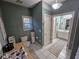 Bathroom featuring a toilet and vanity next to shower at 200 Chaparral Trce, Tyrone, GA 30290
