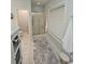 Bathroom featuring a glass-enclosed shower, tile floors, and modern fixtures at 200 Chaparral Trce, Tyrone, GA 30290