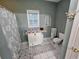 Bathroom with a toilet, storage cabinet, and shower at 200 Chaparral Trce, Tyrone, GA 30290