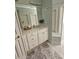 Bright bathroom with a single vanity, large mirror, and ample storage at 200 Chaparral Trce, Tyrone, GA 30290