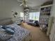 Bright Bedroom features a crib, daybed, shelving with toys, and a cozy sitting area at 200 Chaparral Trce, Tyrone, GA 30290
