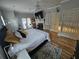 Comfortable bedroom with a queen bed, modern décor, hardwood floors, with a fireplace and glass patio door at 200 Chaparral Trce, Tyrone, GA 30290