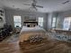 Cozy bedroom with a queen bed, modern décor, hardwood floors, and great natural light with a ceiling fan at 200 Chaparral Trce, Tyrone, GA 30290