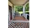 Charming covered porch with decorative railing, inviting guests to a comfortable outdoor space at 200 Chaparral Trce, Tyrone, GA 30290