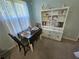 Cozy dining area featuring a table with seating and a decorative hutch, perfect for intimate meals at 200 Chaparral Trce, Tyrone, GA 30290