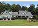 Charming one-story home with gray siding, a lovely front porch, and beautifully landscaped front yard at 200 Chaparral Trce, Tyrone, GA 30290