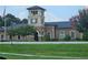 Brick building with clock tower, American flag, and landscaping at 200 Chaparral Trce, Tyrone, GA 30290