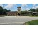 Brick building with clock tower, American flag, and circular driveway at 200 Chaparral Trce, Tyrone, GA 30290