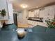 Kitchen boasts dark countertops, white cabinets, and stainless steel appliances, creating a modern, clean look at 200 Chaparral Trce, Tyrone, GA 30290