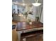 Eat-in kitchen features a dark wood table with bench seating, plus ample cabinet and counter space at 200 Chaparral Trce, Tyrone, GA 30290
