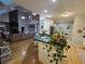 Open kitchen featuring a center island, modern appliances, and hardwood floors flowing into the living area at 200 Chaparral Trce, Tyrone, GA 30290