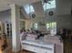 Bright, open living space with large sectional sofa, vaulted ceilings, and access to outdoor deck at 200 Chaparral Trce, Tyrone, GA 30290