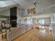 Spacious living room featuring high ceilings, stone fireplace, and hardwood floors for a luxurious ambiance at 200 Chaparral Trce, Tyrone, GA 30290