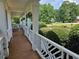 Relaxing porch featuring green landscaping, perfect for enjoying the outdoors in a serene environment at 200 Chaparral Trce, Tyrone, GA 30290