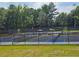 Multiple fenced tennis and pickleball courts available for the neighborhood residents at 200 Chaparral Trce, Tyrone, GA 30290