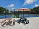 Tennis and pickleball courts with picnic tables and umbrella for a relaxing match at 200 Chaparral Trce, Tyrone, GA 30290