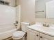 This bathroom features a white vanity, toilet, and tub with white tile surround at 3163 Springside Xing, Decatur, GA 30034