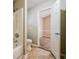 This bathroom features a white vanity, toilet, and tub with white tile surround at 3163 Springside Xing, Decatur, GA 30034