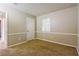 This cozy bedroom features neutral walls with chair rail and plush carpeting at 3163 Springside Xing, Decatur, GA 30034