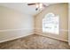 Carpeted bedroom with natural light, featuring a high vaulted ceiling and trim molding at 3163 Springside Xing, Decatur, GA 30034
