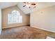 Bright bedroom featuring carpet, vaulted ceiling and a large window at 3163 Springside Xing, Decatur, GA 30034