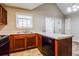 Efficient kitchen with light countertops and wooden cabinets at 3163 Springside Xing, Decatur, GA 30034