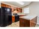 Kitchen showcasing black appliances, wood cabinets, and light countertops at 3163 Springside Xing, Decatur, GA 30034
