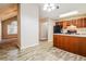 Open-concept kitchen with breakfast bar, black appliances, and ample counter space at 3163 Springside Xing, Decatur, GA 30034