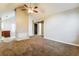 Spacious living room featuring neutral paint, carpet, and a fireplace with view into kitchen at 3163 Springside Xing, Decatur, GA 30034