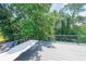 Large back deck overlooking lush greenery, ideal for outdoor gatherings and relaxation at 503 Rising Dr, Woodstock, GA 30189