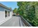 Spacious back deck with serene green views and lots of room for outdoor living at 503 Rising Dr, Woodstock, GA 30189