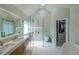 Luxurious bathroom with dual vanity, glass shower, and walk-in closet at 503 Rising Dr, Woodstock, GA 30189