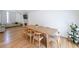 Bright dining room with hardwood floors, modern table and chairs, and ample natural light at 503 Rising Dr, Woodstock, GA 30189