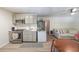 Open concept kitchen with stainless appliances, stylish cabinets, and a view to the living area at 503 Rising Dr, Woodstock, GA 30189