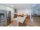 Sleek, modern kitchen featuring stainless steel appliances, a large island, and ample storage at 503 Rising Dr, Woodstock, GA 30189
